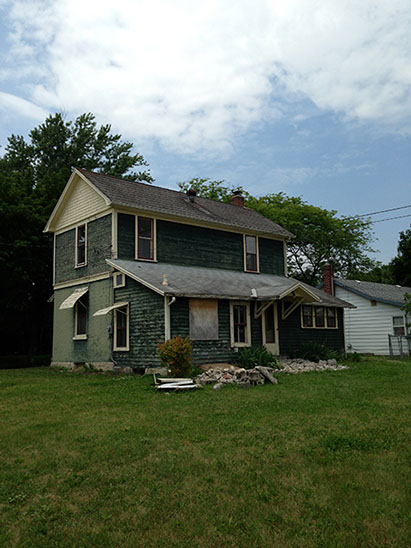green siding, grass backyard