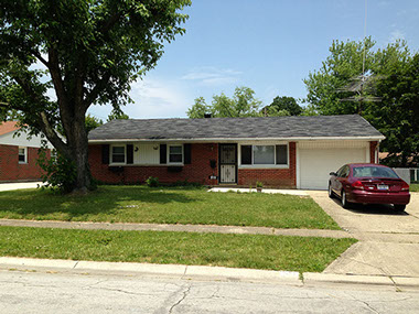 large front tree, grass, red brick