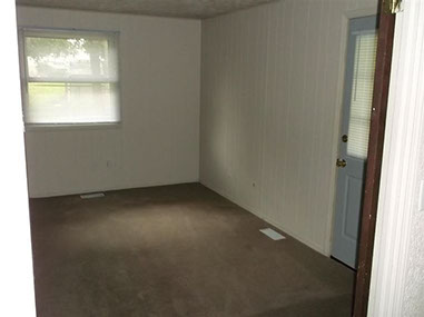 driveway, garage in rear, yellow brick