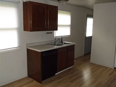 driveway, garage in rear, yellow brick