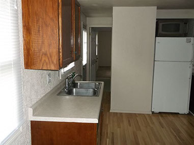 driveway, garage in rear, yellow brick