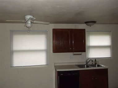 driveway, garage in rear, yellow brick