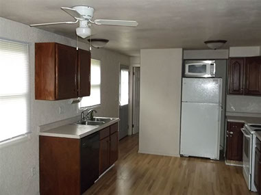driveway, garage in rear, yellow brick