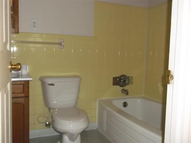 Cape Cod style, driveway, garage in rear