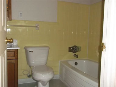 driveway, garage in rear, yellow brick