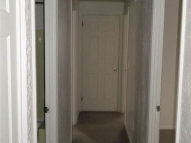 driveway, garage in rear, yellow brick