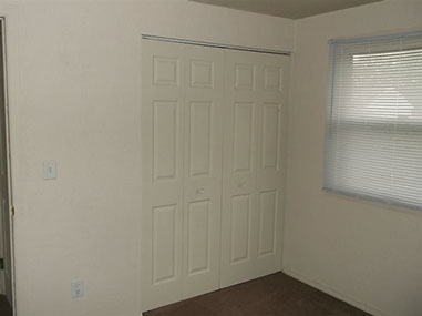 driveway, garage in rear, yellow brick