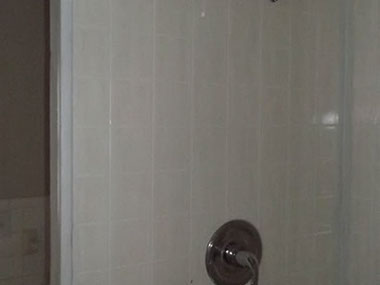 driveway, garage in rear, yellow brick