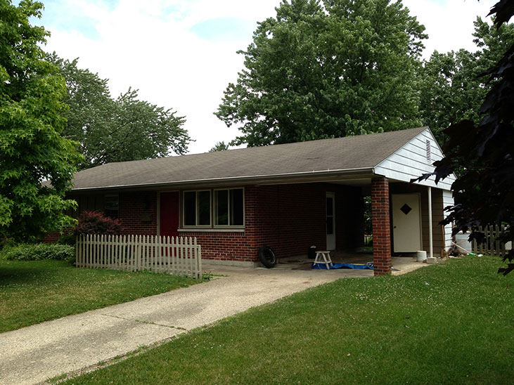 driveway, picket fence, attached covered car port