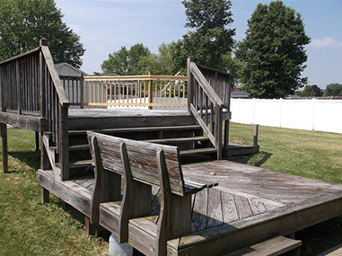 driveway, garage in rear, yellow brick
