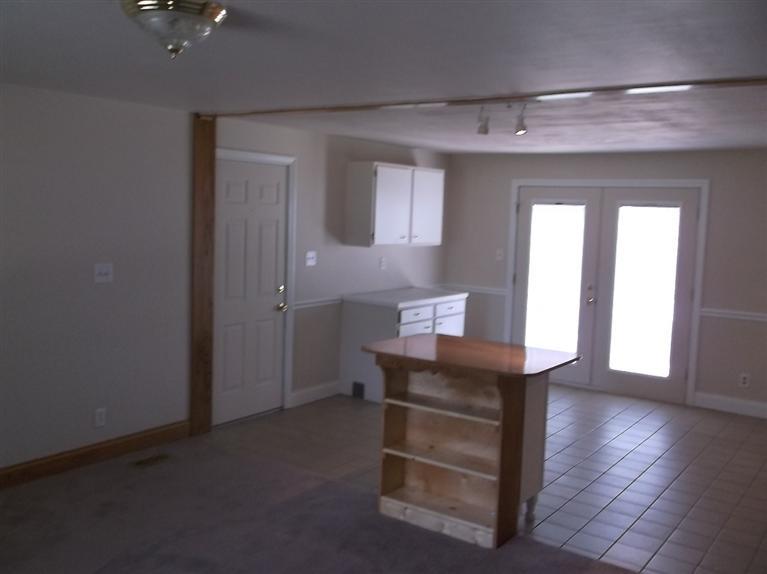 Cape Cod style, driveway, garage in rear