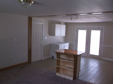 driveway, garage in rear, yellow brick