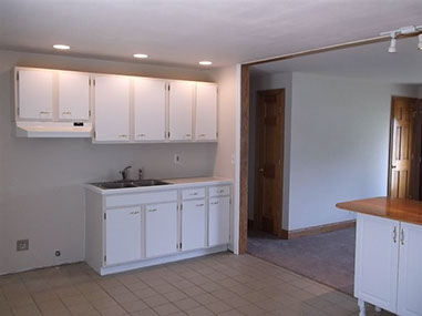 driveway, garage in rear, yellow brick