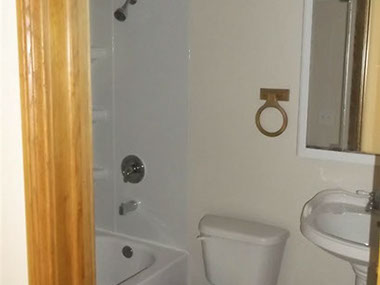 driveway, garage in rear, yellow brick