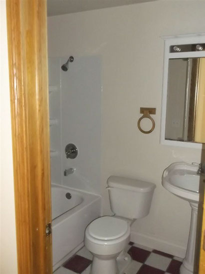 Cape Cod style, driveway, garage in rear