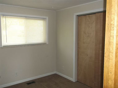 driveway, garage in rear, yellow brick