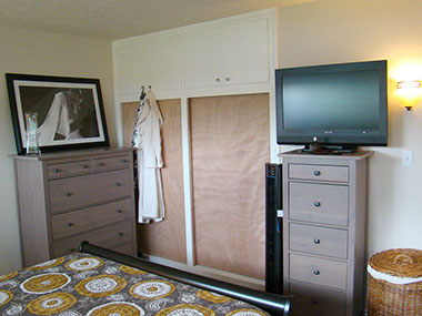 built-in closets, pendant light, 2 dressers