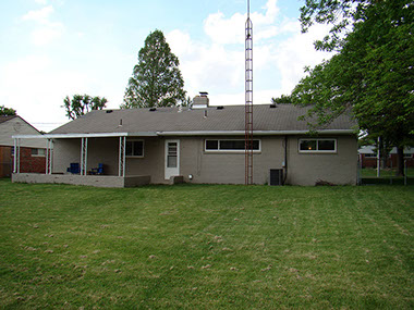 sloped backyard, large back patio, a/c unit