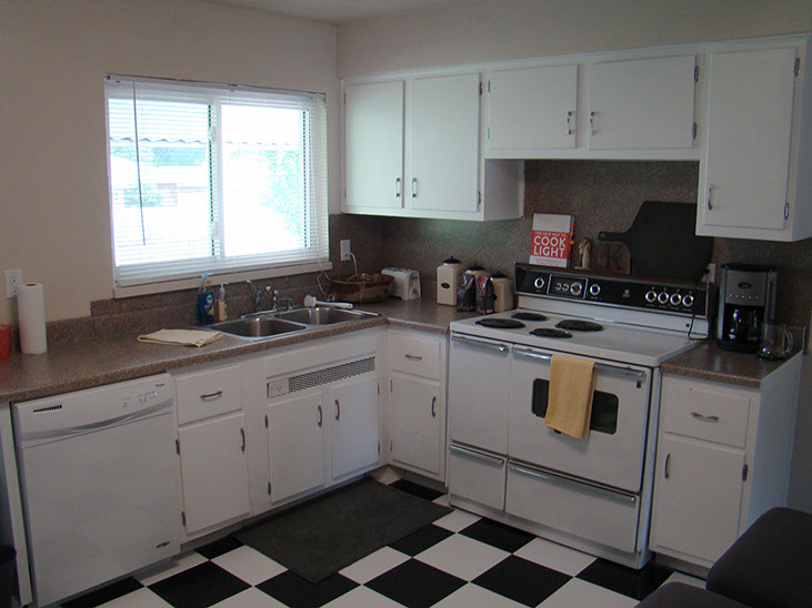 checkered vinyl floor, double sink, stove/oven