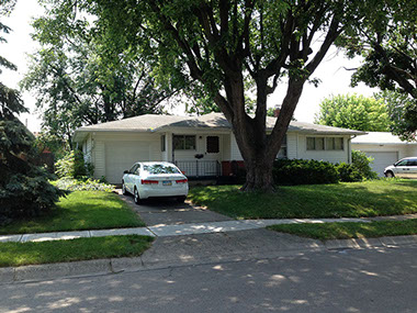 driveway, attached garage, white ext