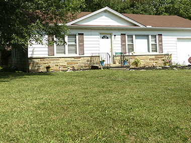 stone, white siding, attached garage