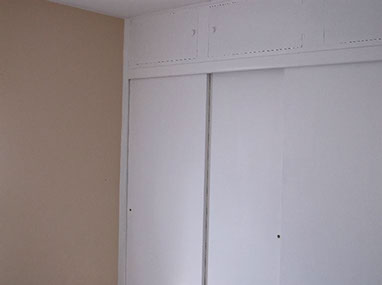 driveway, garage in rear, yellow brick