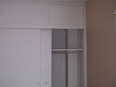 driveway, garage in rear, yellow brick