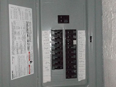 driveway, garage in rear, yellow brick