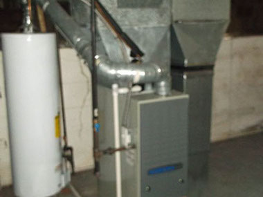 driveway, garage in rear, yellow brick