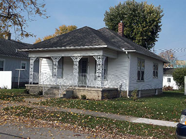 driveway, garage in rear, yellow brick