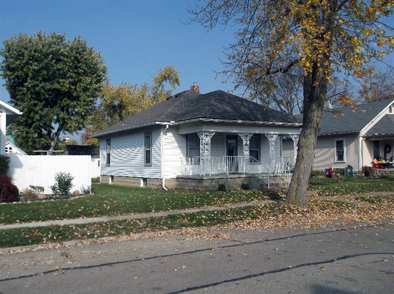 Cape Cod style, driveway, garage in rear