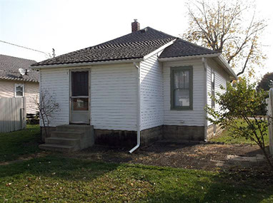 driveway, garage in rear, yellow brick