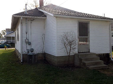 driveway, garage in rear, yellow brick