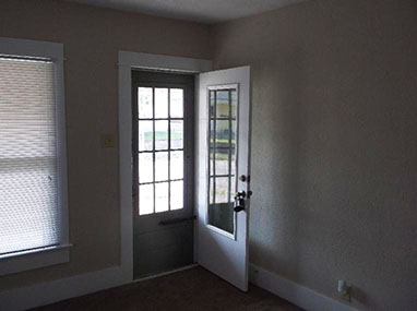 driveway, garage in rear, yellow brick