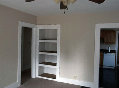 driveway, garage in rear, yellow brick