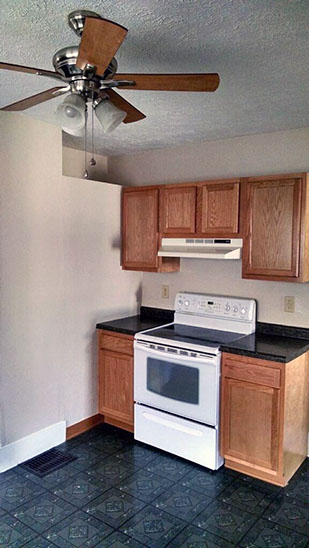 Cape Cod style, driveway, garage in rear