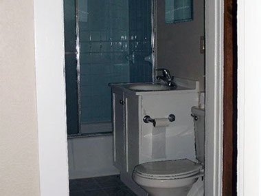 driveway, garage in rear, yellow brick