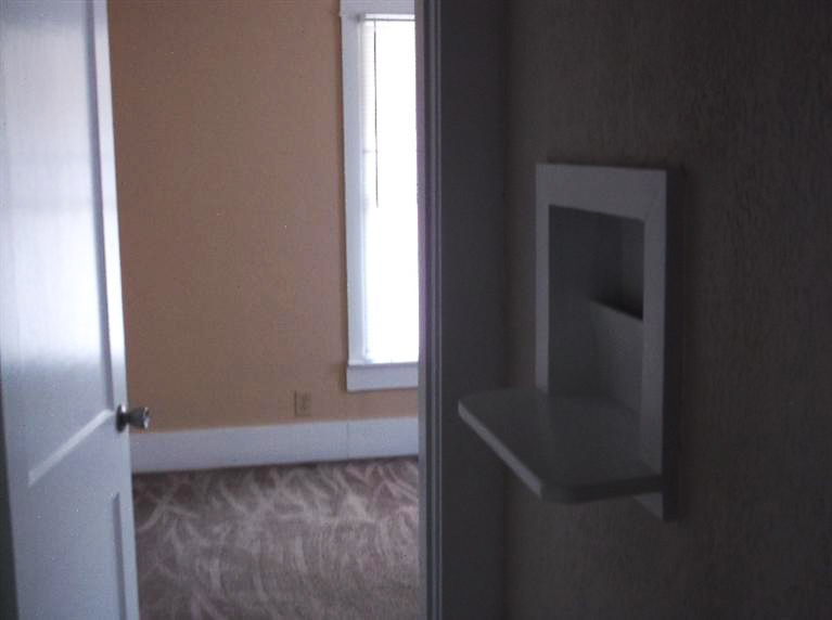 Cape Cod style, driveway, garage in rear