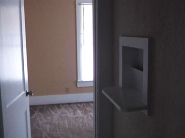 driveway, garage in rear, yellow brick