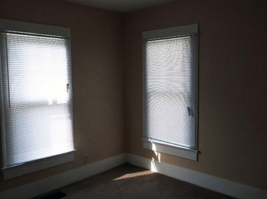 driveway, garage in rear, yellow brick